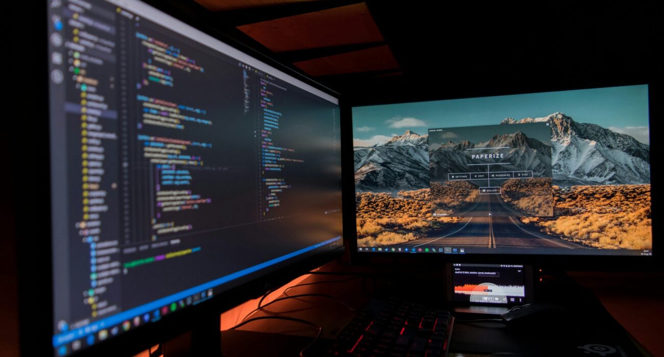 two black flat screen computer monitors